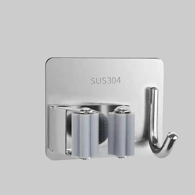 Compact self-adhesive mop and broom organizer mounted on wall holding cleaning tools neatly in bathroom