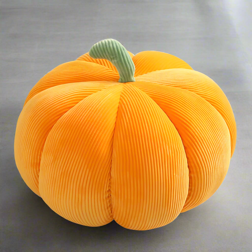 Cute plush pumpkin pillow for cozy autumn nights and Halloween decorations