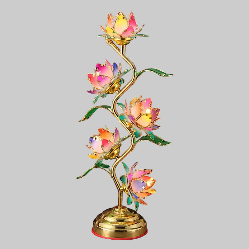 Glowing lotus lamp placed on a wooden nightstand.