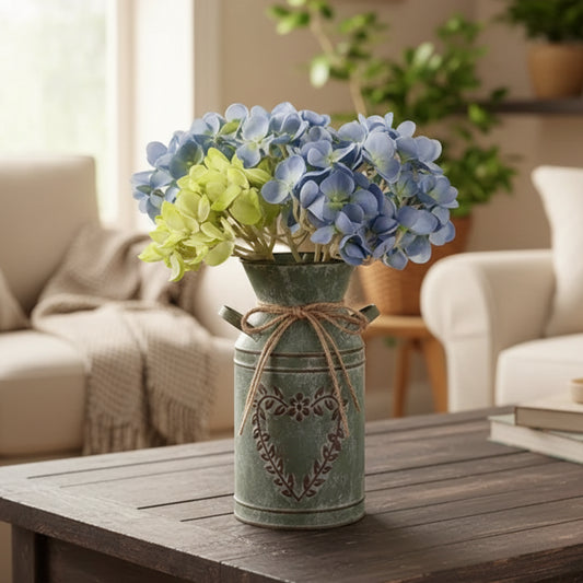 Rustic sage green milk churn vase with embossed floral heart detail and jute twine bow, antique style metal farmhouse vase for dried flowers